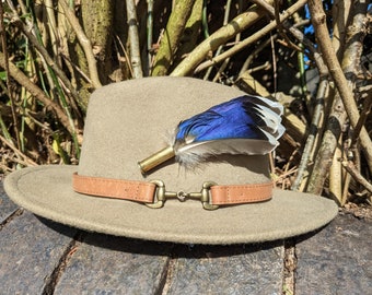 Blue mallard feather fedora hat pin or brooch in a 357 calibre shell.
