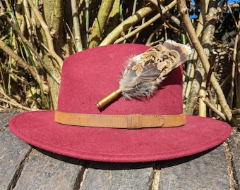 Buzzard, pheasant and woodcock feather fedora hat pin or brooch in a 221 calibre shell.
