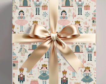 May include: A wrapped gift with a cream-colored paper featuring a repeating pattern of nutcrackers, princesses, and castles. The gift is tied with a wide, gold satin ribbon and bow. The overall theme is festive and whimsical.