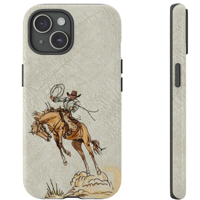 May include: A white leather iPhone case with a brown cowboy riding a bucking horse. The cowboy is wearing a brown hat and a white shirt. The horse is brown with a white mane and tail.
