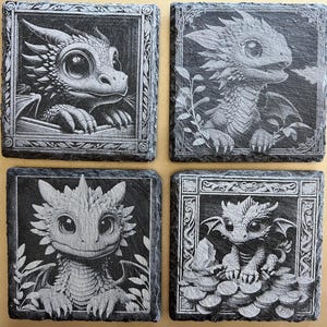 Set of 4 slate coasters featuring baby dragons