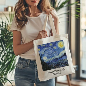 May include: White tote bag with a blue and yellow print of Vincent van Gogh's Starry Night painting. The text "Vincent van Gogh Starry Night" is printed in black at the bottom of the bag.
