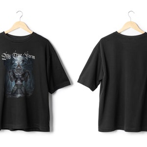May include: Black t-shirt with a graphic print of a werewolf with the text "My True Form" on the front. The back of the shirt is plain.