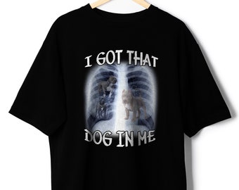 May include: Black t-shirt with a graphic of an x-ray image of a dog's chest. The text "I got that dog in me" is printed below the image.