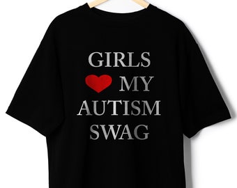 May include: Black t-shirt with the text "GIRLS ♥ MY AUTISM SWAG" in white and red.