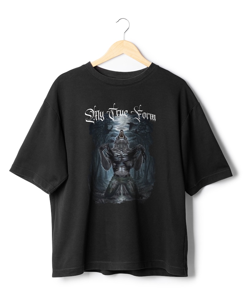May include: Black t-shirt with a graphic print of a werewolf howling at the moon in a forest. The text "My True Form" is printed above the werewolf.