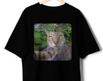 May include: Black t-shirt with a graphic of a cat looking at the camera with the text "rule #3: get outdoors" printed on it.