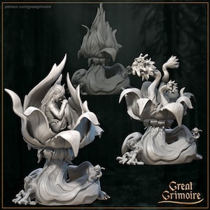 May include: Three grey, sculpted, fantasy figures of a flower with a creature inside. The flower is a large, open bloom with a stem and leaves. The creature is a small, humanoid figure with long hair and a flowing dress. The figures are in various poses, with one sitting upright, one reclining, and one standing. The figures are made of a smooth, grey material and have a detailed, realistic appearance.