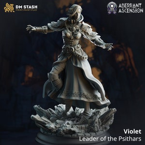 May include: A gray painted miniature figurine of a female character wearing a long robe and armor. The character is standing on a rocky base and has a determined expression on her face. The text "Violet Leader of the Psithars" is printed below the base.