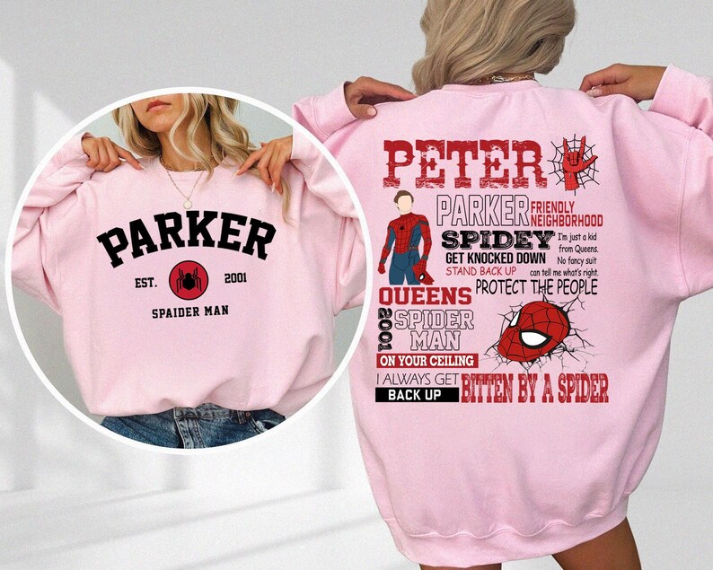 May include: Pink sweatshirt with a graphic design featuring a superhero character, the text "Peter Parker", and the words "Friendly Neighborhood Spidey". The text "Get Knocked Down, Stand Back Up, Protect the People" is also included. The back of the sweatshirt has the text "Parker Est. 2001 Spaider Man" with a spider graphic.