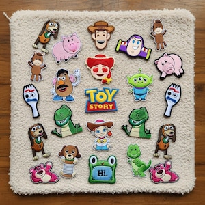 Toy Story inspired embroidered patch collection with alien cowboy dinosaur pig and cartoon toy characters displayed in numbered set