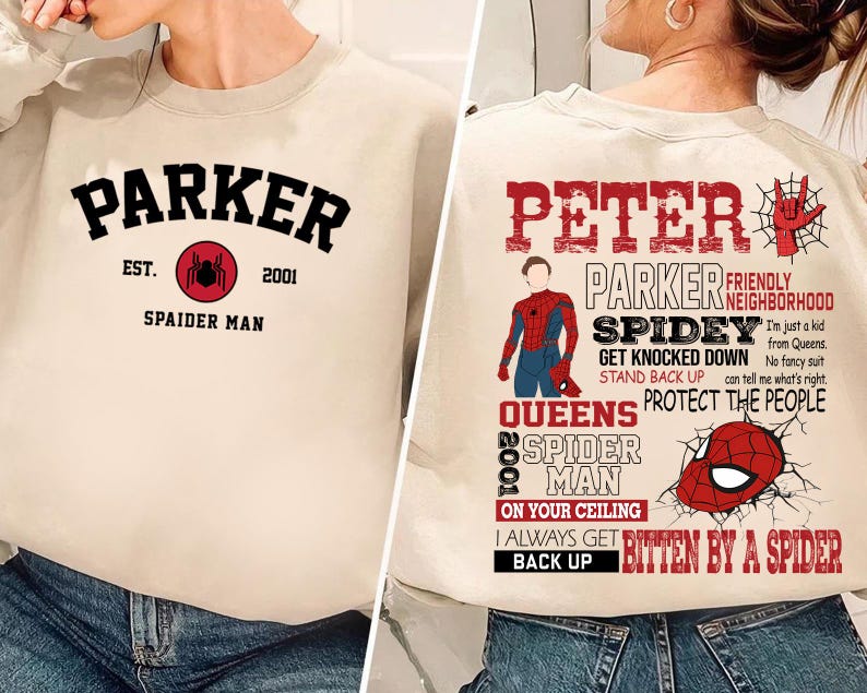 May include: Beige sweatshirt with black text that reads "Parker Est. 2001 Spaider Man" with a red spider graphic. Beige sweatshirt with black text that reads "Peter Parker Friendly Neighborhood Spidey Get Knocked Down Stand Back Up Queens Protect The People 2002 Spider Man On Your Ceiling I Always Get Bitten By A Spider Back Up" with a red spider graphic.