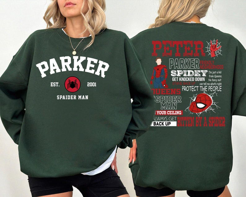 May include: Green sweatshirt with a spider-man theme. The front has the text "Parker Est. 2001 Spaider Man" with a spider graphic. The back has the text "Peter Parker Spidey Get Knocked Down Queens Spider Man Your Ceiling Always Get Bitten By A Spider Back Up".
