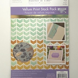 May include: Vellum print stack pack with a chevron pattern in shades of green, orange, and gold. The package includes 12 sheets and features the text "Forever in Time" and "Paper Craft Collection". The dimensions are 14.8 cm x 21 cm.