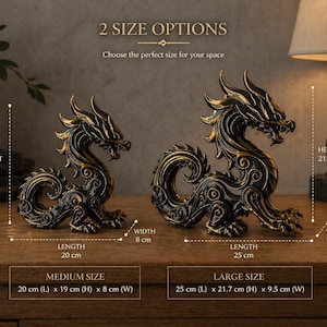 May include: Two dragon sculptures in antique gold and black. The medium dragon is 20 cm long, 19 cm high, and 8 cm wide. The large dragon is 25 cm long, 21.7 cm high, and 9.5 cm wide. The text reads "2 SIZE OPTIONS".