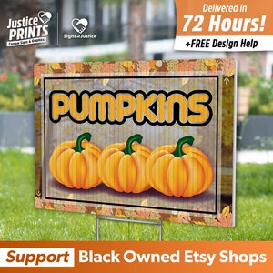 May include: A brown and orange yard sign with the text "PUMPKINS" in a retro font. Three orange pumpkins are depicted in the center of the sign. The sign has a fall-themed border with brown and orange leaves.