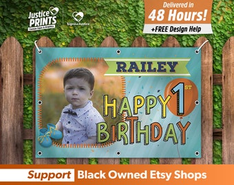 May include: A blue and orange birthday banner with the name "RAILEY" and the text "HAPPY 1ST BIRTHDAY". A photo of a young child is in the upper left corner of the banner.