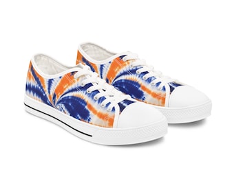 May include: A pair of white canvas low-top trainers with orange and blue tie-dye pattern.