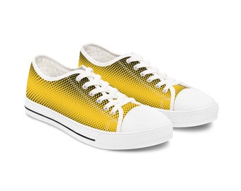 May include: A pair of yellow and black low-top canvas sneakers with a black polka dot pattern.