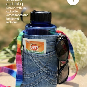 May include: A blue denim water bottle holder featuring a rainbow-striped adjustable strap and lining. The holder includes an exterior pocket containing an Off! Deep Woods insect repellent packet and a pair of black sunglasses attached to the side.