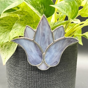 May include: A purple stained glass lotus flower design, perfect for adding a touch of elegance to a plant pot.