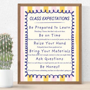 May include: A rectangular wall print in a brown frame featuring vertical yellow and pink stripes. The text reads: CLASS EXPECTATIONS, Be Prepared to Learn, Be on Time, Raise Your Hand, Bring Your Materials, Ask Questions, and Be Honest.