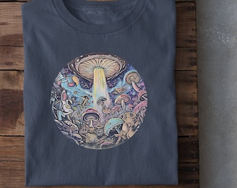 May include: A heather navy blue t-shirt with a graphic of a mushroom forest and a UFO. The graphic features a variety of colorful mushrooms, small creatures, and a glowing beam of light.