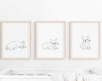 May include: Three framed illustrations of a French bulldog puppy in different poses. Each illustration features a black and white line drawing of the puppy with a small butterfly in gold.
