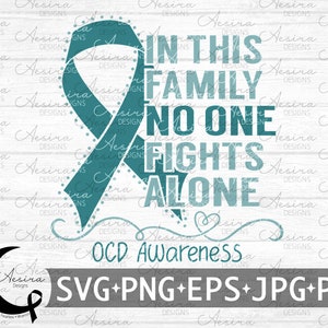 May include: Teal blue ribbon with the text "In this family no one fights alone" and "OCD Awareness" below the ribbon. The ribbon is on a white wood background.