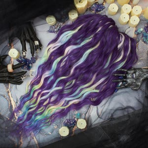 May include: A set of three ceramic mugs with a speckled, matte finish. The mugs are in shades of cream, light grey, and dark grey. Each mug has a simple, minimalist design, ideal for coffee or tea.