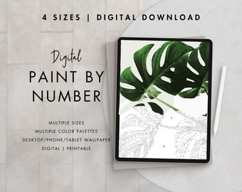 May include: Digital paint by number image of a green monstera leaf on a white background. The image is displayed on a tablet with a stylus next to it. The text "Digital Paint By Number" is displayed above the image.