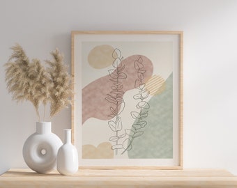 May include: A framed print with a minimalist line drawing of eucalyptus leaves in front of abstract shapes in shades of pink, green, and yellow.
