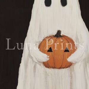 Peut inclure: Un fant&ocirc;me blanc tenant une citrouille orange avec un visage triangulaire noir. Le fant&ocirc;me a deux yeux noirs.