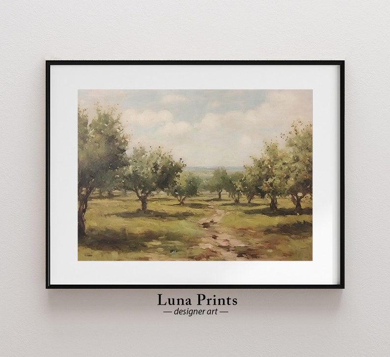 May include: A framed painting of a landscape with a dirt path leading through a field of trees. The trees are green and the sky is blue with white clouds. The painting is in a black frame.