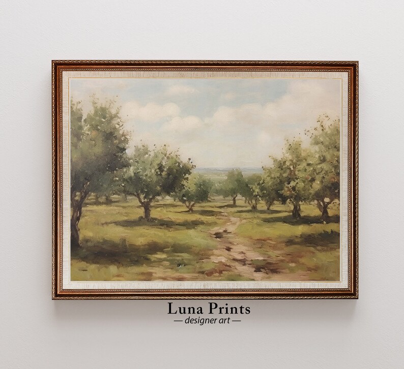 May include: A framed painting of a landscape with a dirt path leading through a field of trees. The trees are green and the sky is blue with white clouds. The painting is in a brown frame with a gold trim.