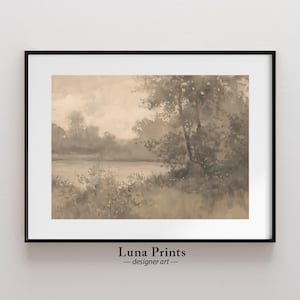 May include: A framed sepia-toned watercolor painting of a misty lake scene with trees and foliage in the foreground. The painting has a soft, dreamy feel and evokes a sense of tranquility.