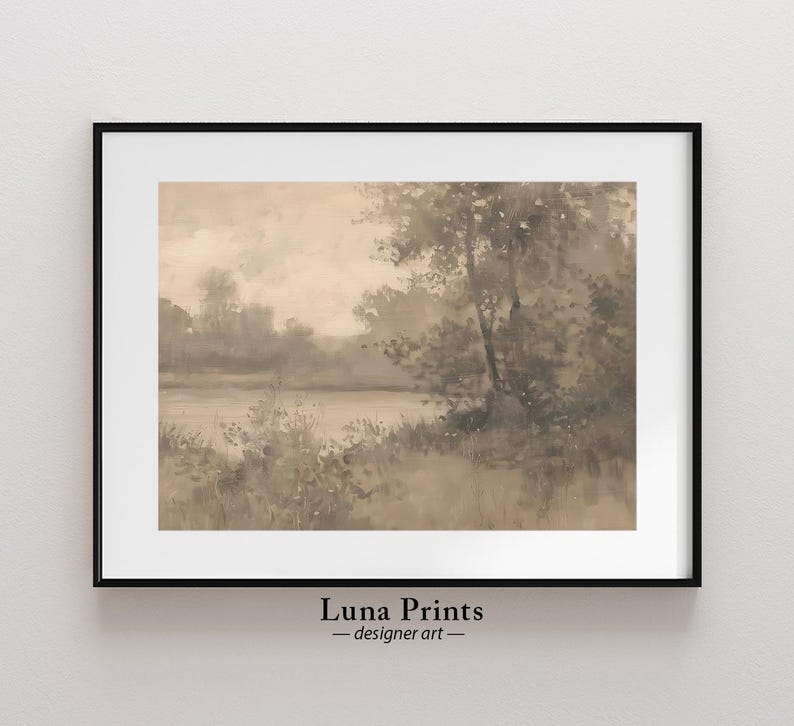May include: A framed sepia-toned watercolor painting of a misty lake scene with trees and foliage in the foreground. The painting has a soft, dreamy feel and evokes a sense of tranquility.