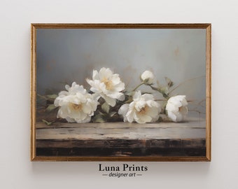 May include: A framed painting of white peonies on a wooden surface. The background is a light blue color. The painting is titled "Luna Prints - designer art".