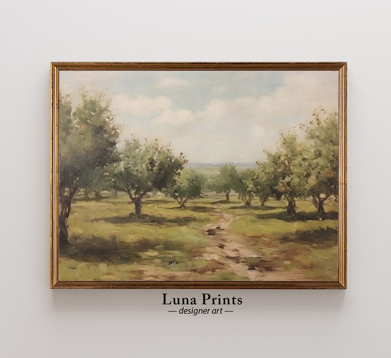 May include: A framed painting of a landscape with a dirt path leading through a field of trees. The trees are green and the sky is blue with white clouds. The painting is in a gold frame.