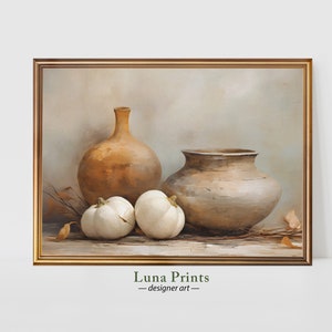 May include: A still life painting depicting three white pumpkins, a large brown clay pot, and a smaller brown clay vase. The background is a muted beige with hints of blue.