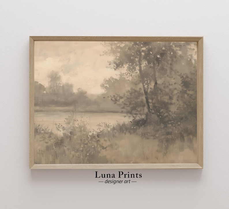 May include: A framed watercolor painting of a misty lake scene with trees and foliage in shades of gray and brown. The painting has a soft, ethereal feel and evokes a sense of tranquility.