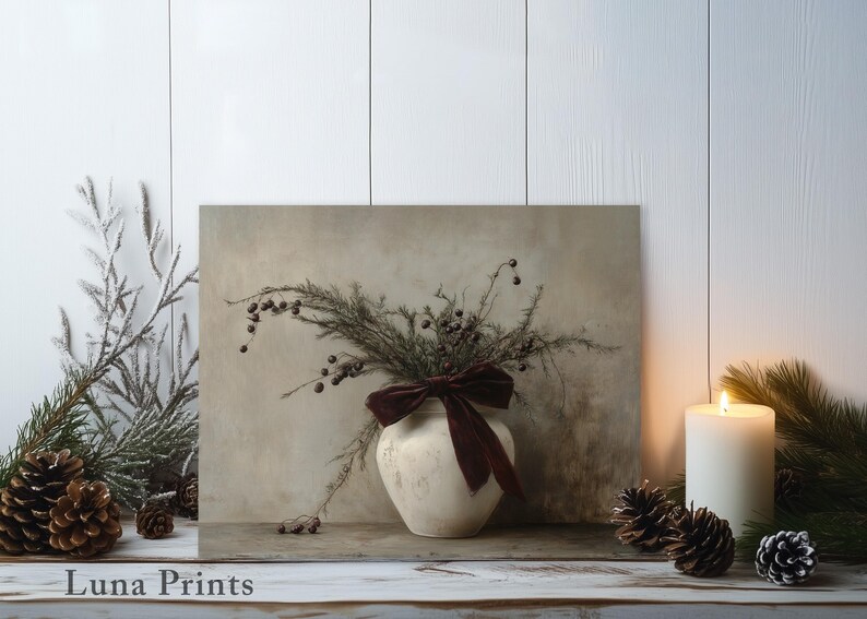 May include: A white ceramic vase with a burgundy velvet bow sits on a wooden shelf. The vase is filled with dried branches and berries. The background is a white wall with a wood grain texture.