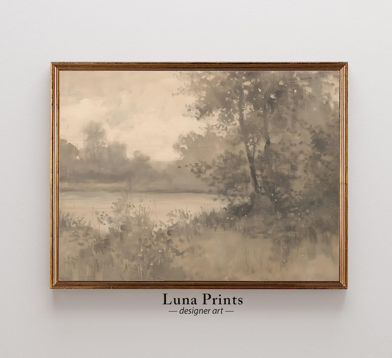 May include: A framed watercolor painting of a misty landscape with a lake and trees in shades of gray and brown.