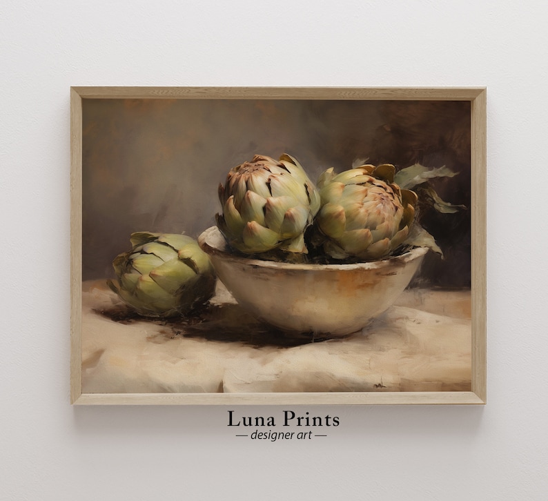 May include: A still life painting of three artichokes in a white bowl on a beige tablecloth. The artichokes are green and brown with a textured surface. The painting has a soft, muted color palette.
