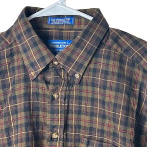 May include: A rustic wooden sign with the text "Welcome to our home" in white lettering. The sign features a distressed finish and a simple, inviting design, perfect for entryway decor.