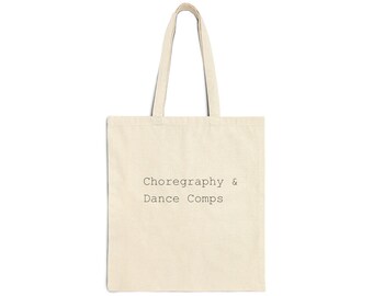 May include: Cream-colored tote bag with the text "Choreography & Dance Comps" printed in a simple, sans-serif font. The bag has a rectangular shape with two handles, perfect for carrying books, groceries, or other items.