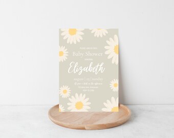 Può includere: Un invito per un baby shower con un design a margherita. L'invito ha uno sfondo verde chiaro con illustrazioni di margherite. Il testo include "Baby Shower", "Elizabeth", la data e l'ora dell'evento.