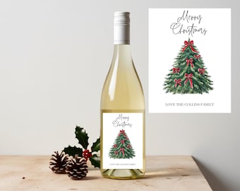 May include: A bottle of white wine with a Christmas-themed label. The label features a watercolor illustration of a Christmas tree decorated with red bows, with the words "Merry Christmas" and "Love the Collins Family".