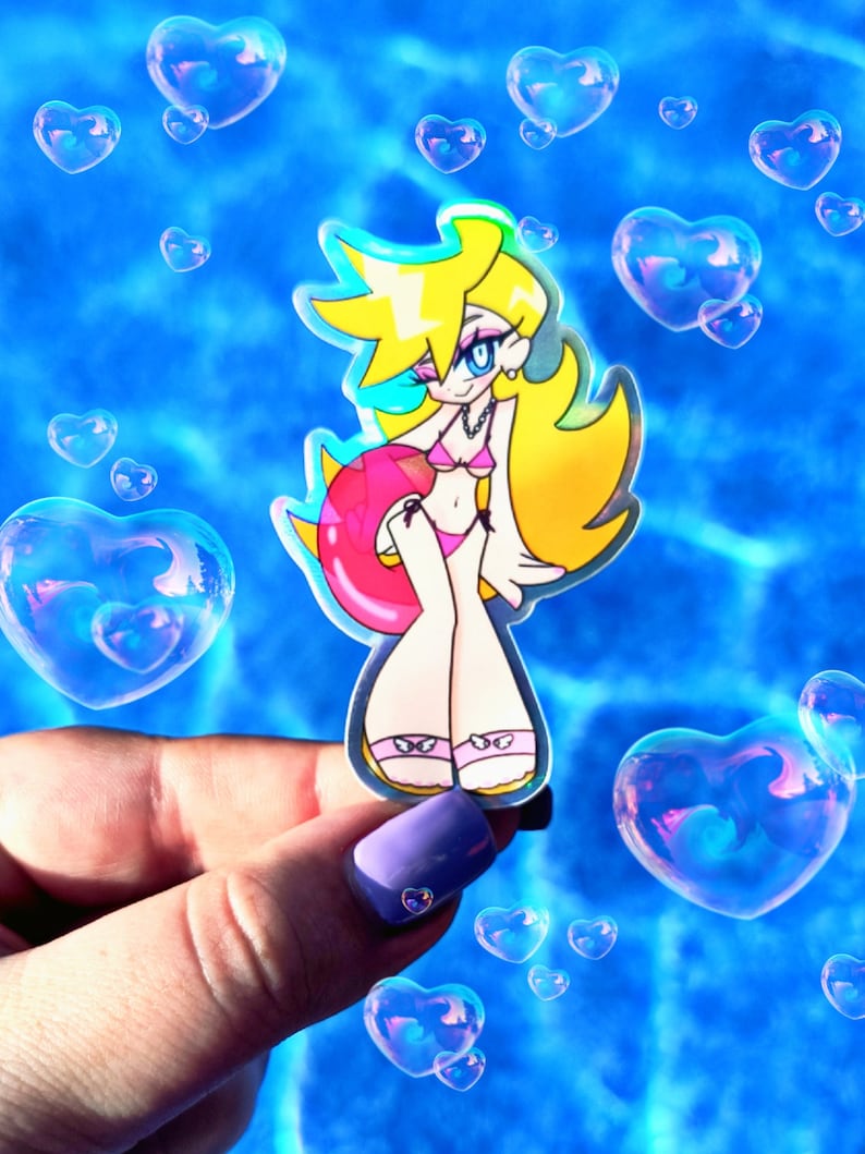 May include: A sticker of a cartoon character wearing a pink bikini and holding a pink inflatable ring. The character has blonde hair and blue eyes. The sticker is on a blue background with heart-shaped bubbles.