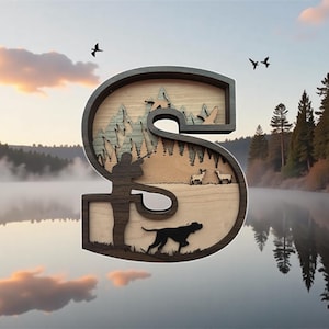 May include: Wooden letter "S" with a layered design depicting a hunting scene. The scene includes a hunter, dog, deer, trees, and mountains. The letter is framed in a dark brown color, with a natural wood interior.